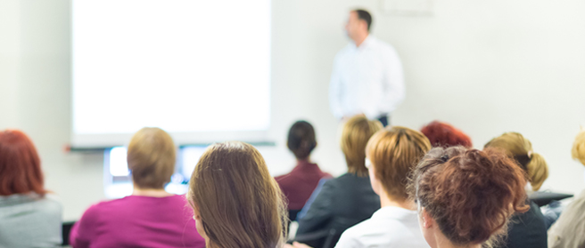 adults sitting in lecture room